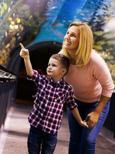 Mother and child visiting an aquarium
