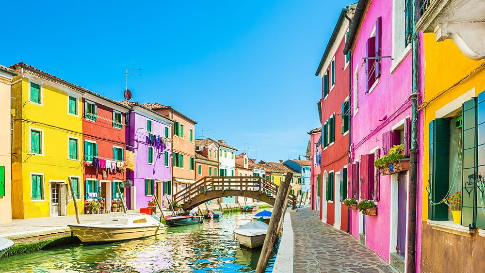 Colourful houses along a canal in Burano - Venice