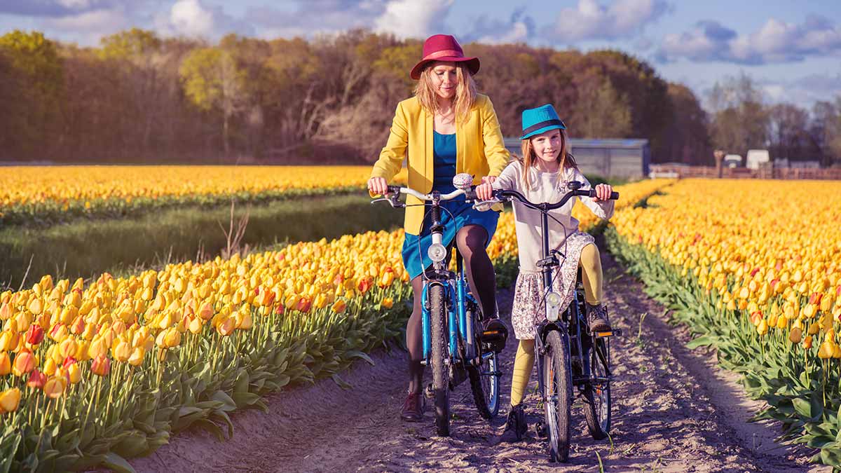 Mum and daughter riding a bike in Holland