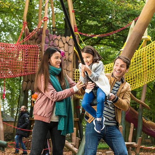 Family playing in forest of legends, Les Village Nature.