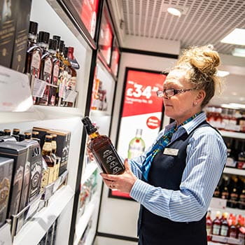 lady in shop with whiskey