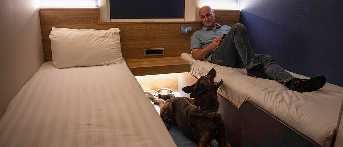 Dog and owner in Dog Cabin at night time on P&O Ferries